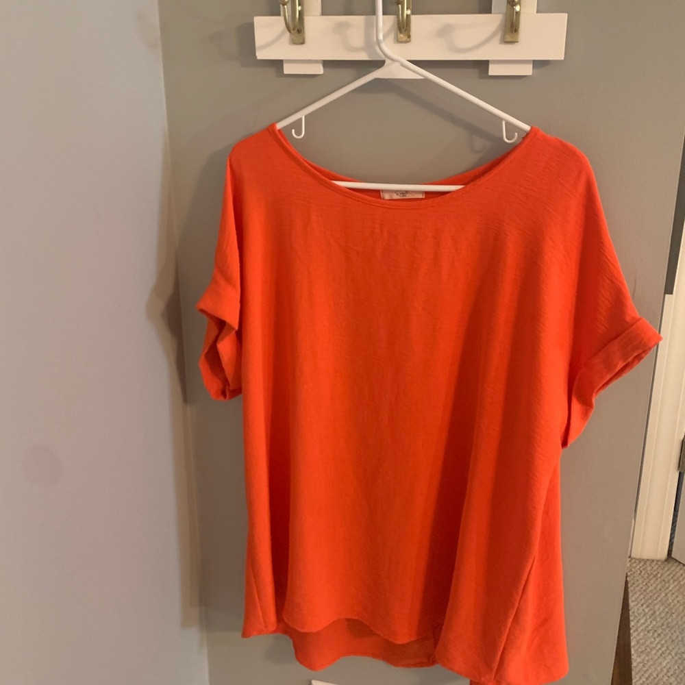 Easel brand orange top, size large.